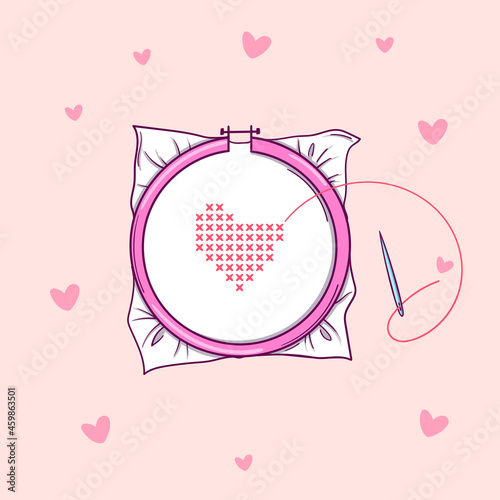 Embroidery hoops with red heart embroidered with a cross on pink background with hearts