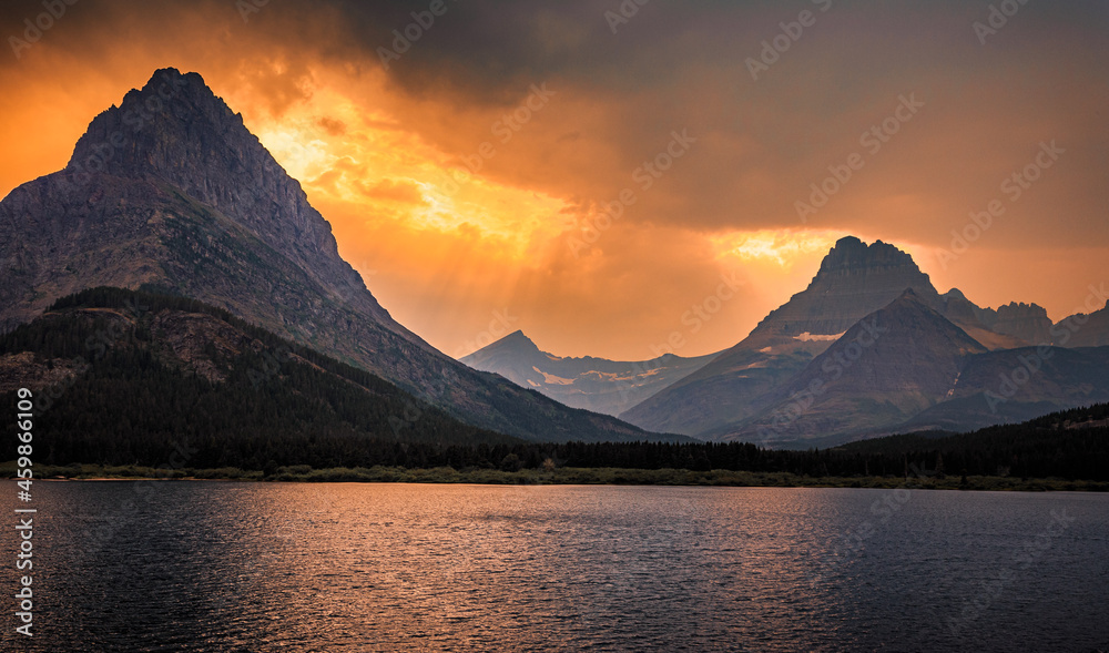 Swiftcurrent Lake and Mountain Fire Sky Sunset at Many Glacier, Glacier National Park, Montana