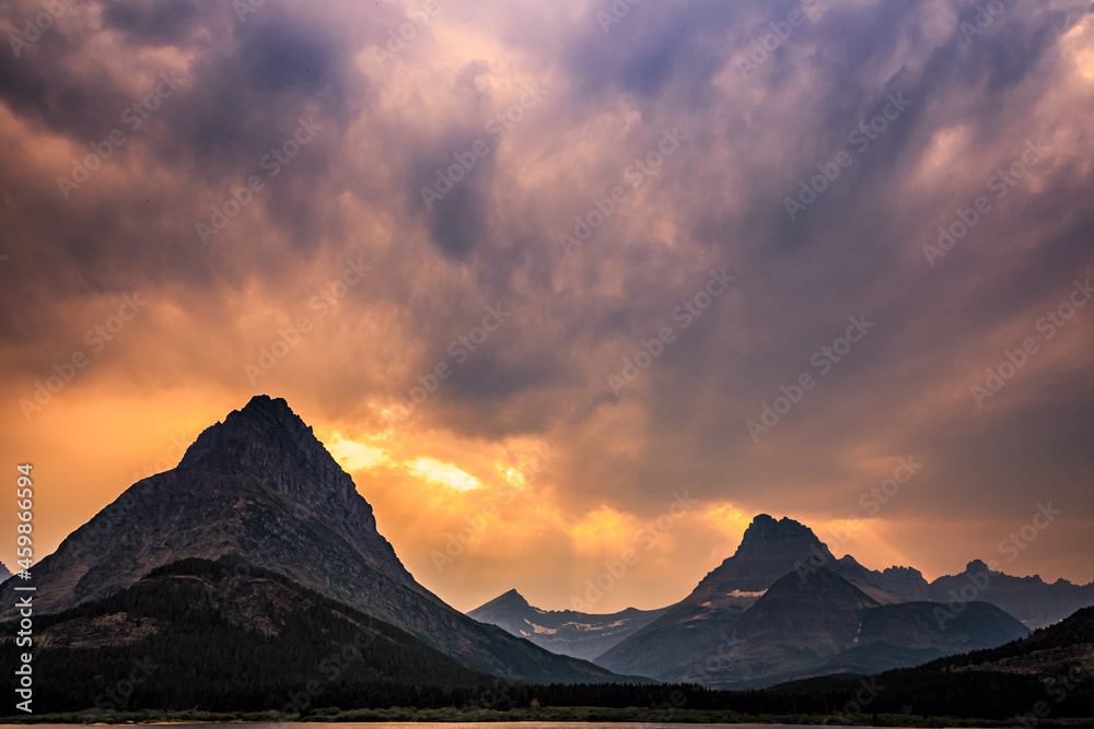 Swiftcurrent Lake and Mountain Fire Sky Sunset at Many Glacier, Glacier National Park, Montana