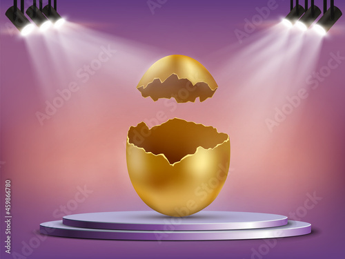 Open golden egg with shells on the podium.