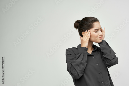 woman in black shirt migraine stress negative isolated background