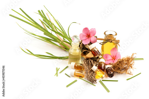 Vetiver grass or vetiveria zizanioides, essential oil and perfume isolated on white background. photo