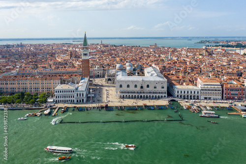 Italy, Veneto, Venice, Aerial view of Riva degli Schiavoni waterfront with Doges Palace in background photo