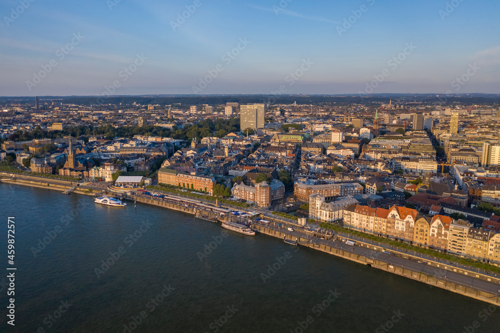 Germany, North Rhine-Westphalia, Dusseldorf, Aerial view of riverside city at dusk Germany, North Rhine-Westphalia, Dusseldorf, Aerial view of riverside city at dusk