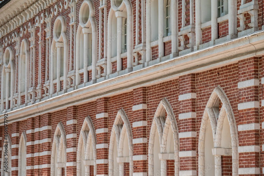 Brick wall of an old 18th century building with large windows. Brick wall of an old 18th century building with large windows.