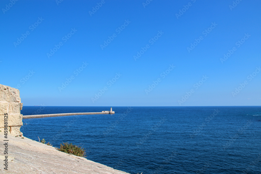 pier and mediterranean sea in valletta (malta) 