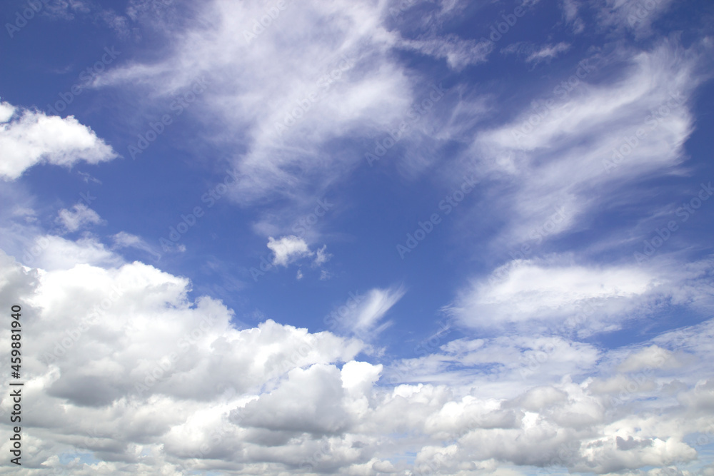 blue sky background with tiny clouds.