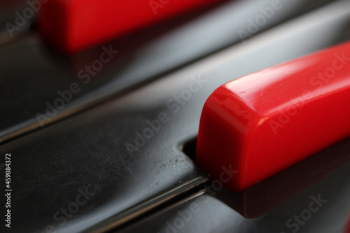 Wall Mural Closeup of black and red keys of  melodica keyboard