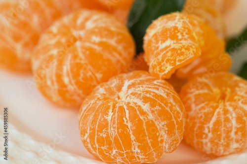 Peeled tangerines on a plate.