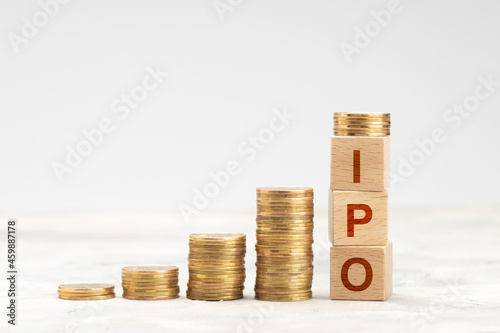 Raising money from IPO. Stacks of coins, steps up photo