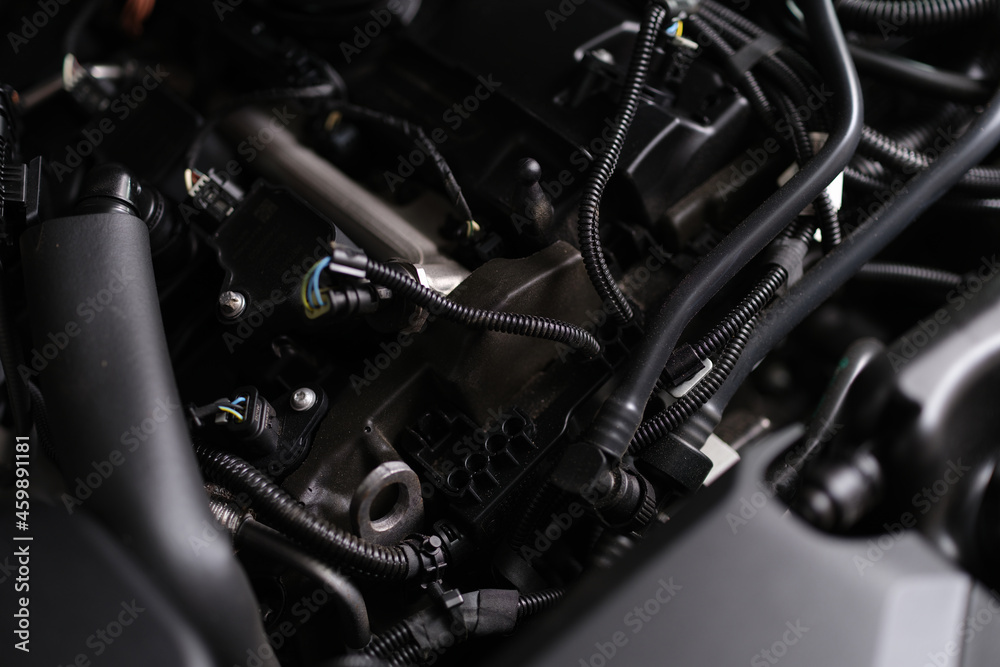 Closeup of electronics and engine under hood of car Closeup of electronics and engine under hood of car