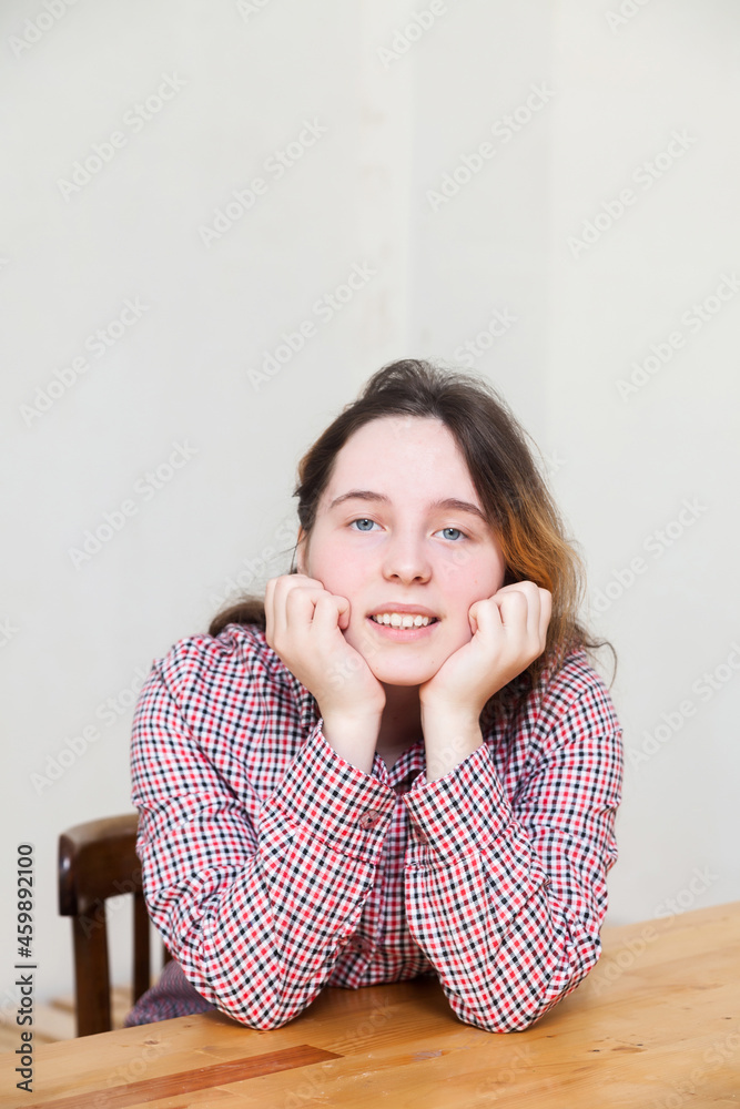 Teen girl with long hair posing in studio Teen girl with long hair posing in studio