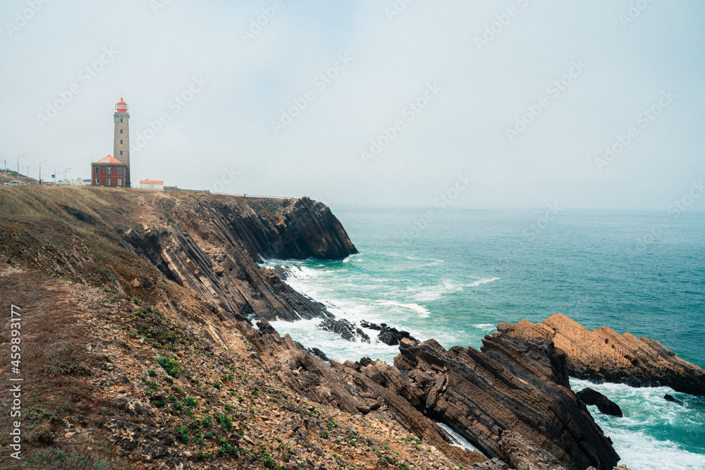 Wide shot of a Lighthouse on the Atlantic Coast on a foggy day