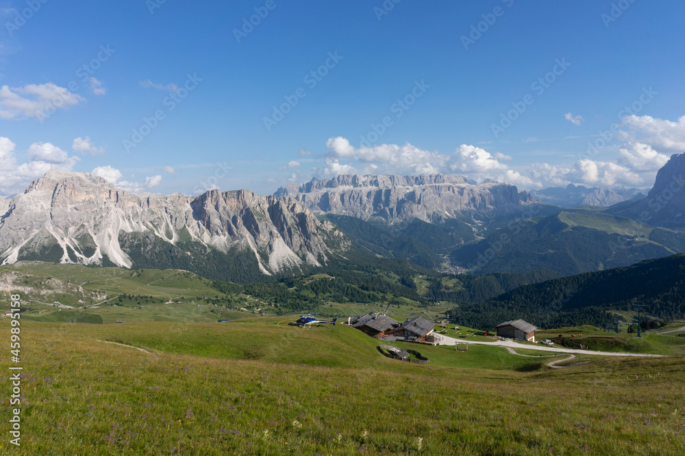 Seceda Mountains in the Dolomites, Trentino Alto Adige, Val di Funes Valley, South Tyrol in Italy, Odle Mountains in the background, Italy. Seceda Mountains in the Dolomites, Trentino Alto Adige, Val di Funes Valley, South Tyrol in Italy, Odle Mountains in the background, Italy.
