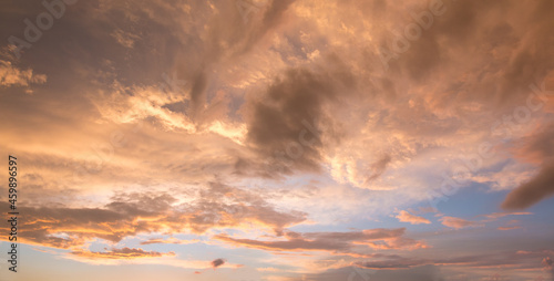 bright sunset scenery with yellow and orange shiny clouds