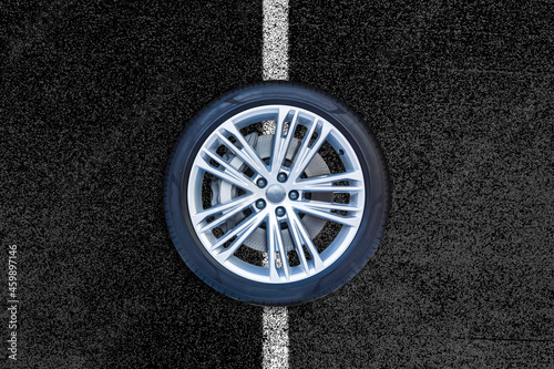 Car wheels isolated on a road background.