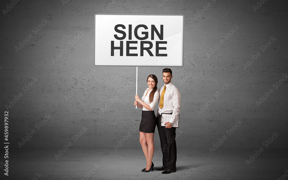 business person holding a traffic sign business person holding a traffic sign