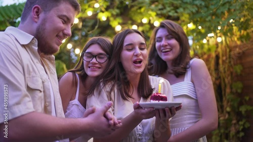 4K 10 bit. Birthday party with friends. Make a wish. Birthday cake with candle. Anniversary celebration