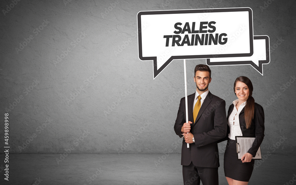 business person in casual holding road sign business person in casual holding road sign