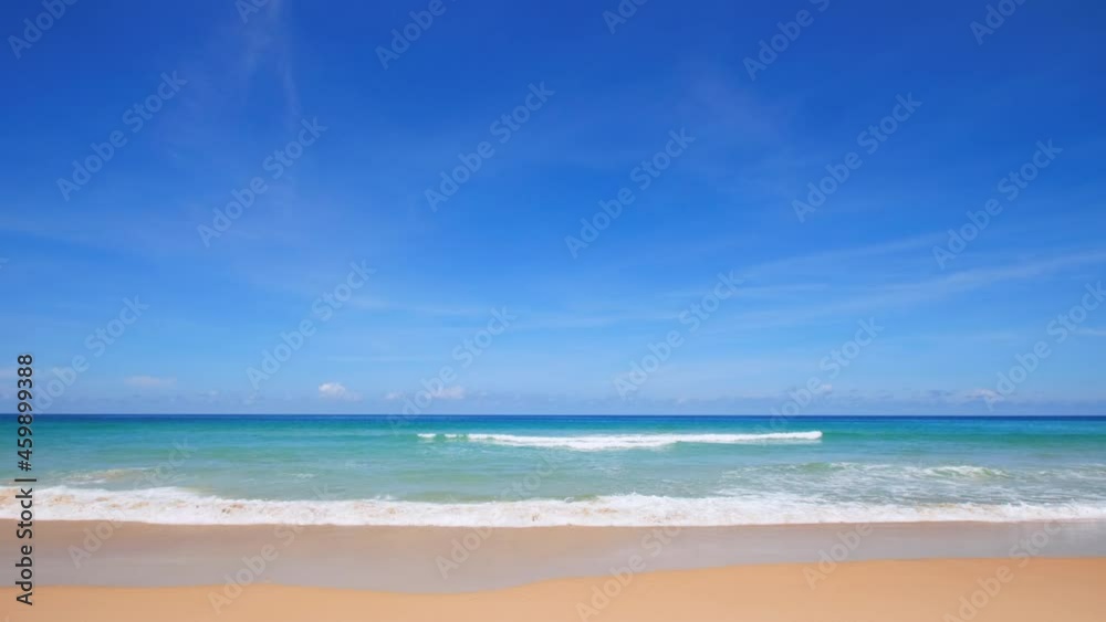 Phuket beach Thailand. Beautiful tropical beach with blue sky and clouds. Tropical beach with waves crashing empty beach. Andaman Sea sand and sky on beautiful summer day holiday Phuket beach Thailand. Beautiful tropical beach with blue sky and clouds. Tropical beach with waves crashing empty beach. Andaman Sea sand and sky on beautiful summer day holiday