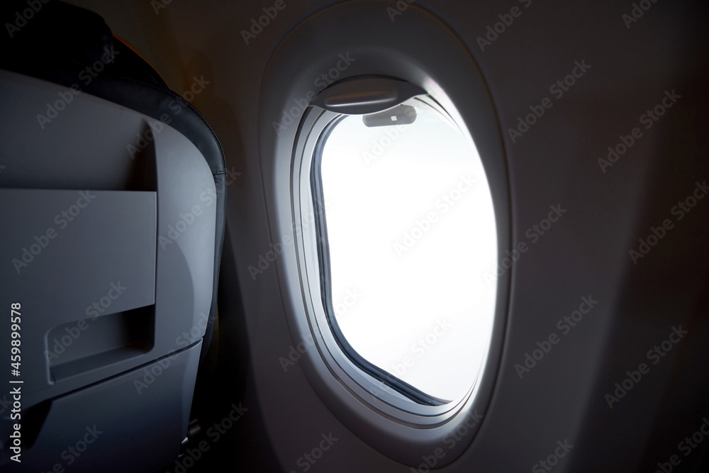 Close-up airplane cabin window during the journey
