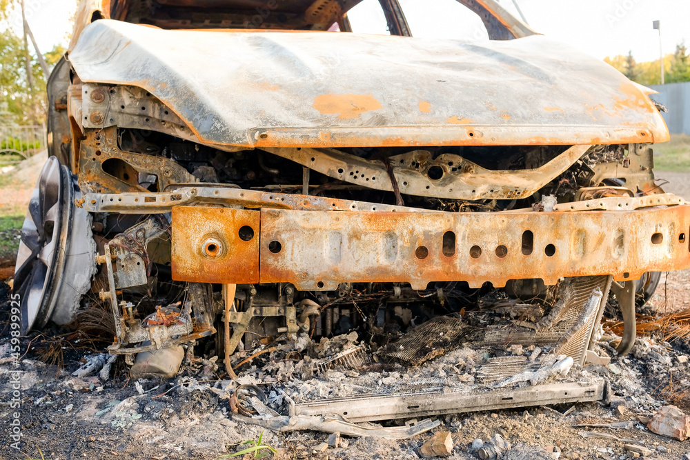 The front of a burned-out car. No people