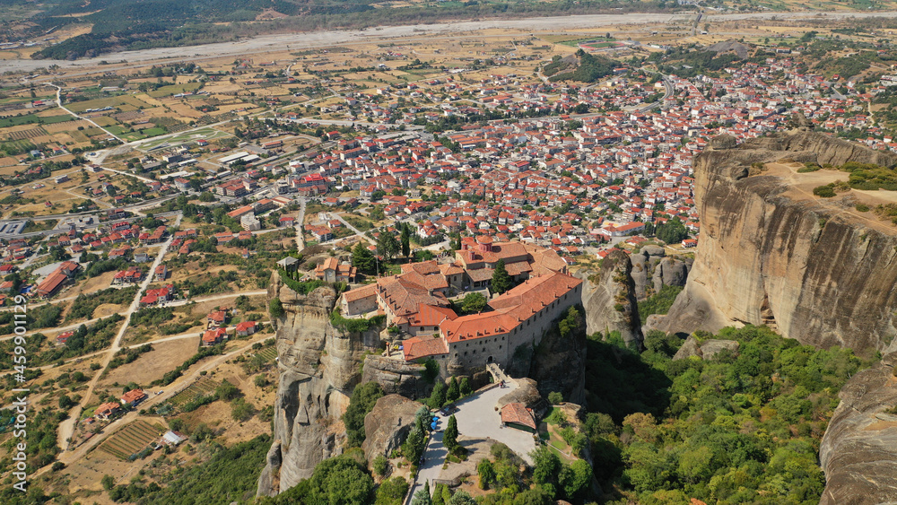 Aerial drone photo of iconic Holy Trinity Monastery at Meteora monasteries complex of immense natural pillars and hill-like rounded, an Unesco World Heritage site, Western region of Thessaly, Greece