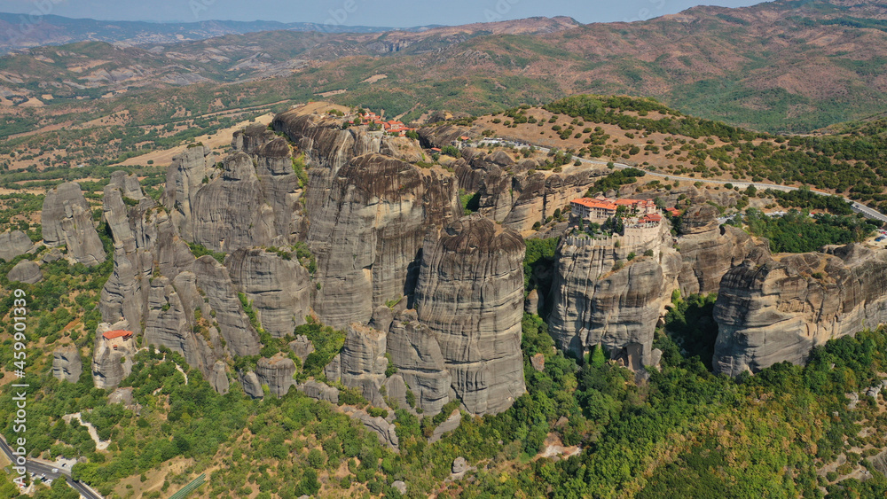 Aerial drone photo of iconic Monastery of Rousanou at Meteora monasteries complex of immense natural pillars and hill-like rounded stones, an Unesco World Heritage site, Thessaly, Greece