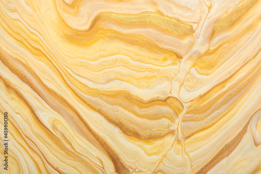 Abstract fluid art background light beige and golden colors. Liquid marble. Acrylic painting with yellow gradient Abstract fluid art background light beige and golden colors. Liquid marble. Acrylic painting with yellow gradient