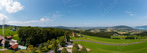 Austria, Upper Austria, Strass im Attergau, Drone panorama of countryside village in summer photo