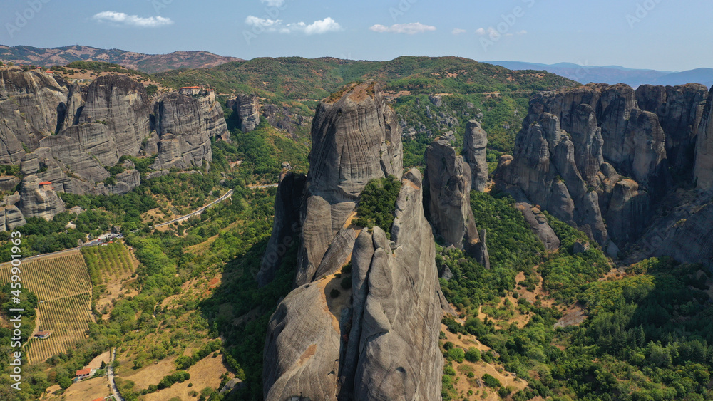Fototapeta premium Aerial drone photo of iconic Meteora rock formation complex of immense natural pillars and hill-like rounded stones, an Unesco World Heritage site, Thessaly, Greece
