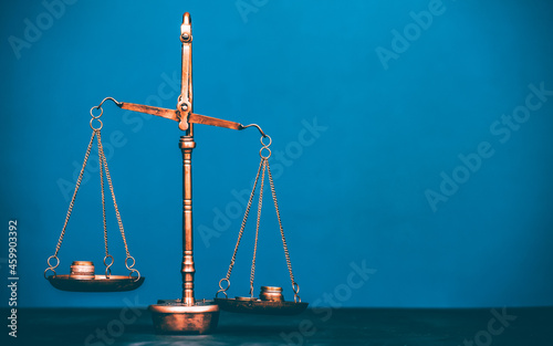 Money weighing on justice scale. Payment balance and tax