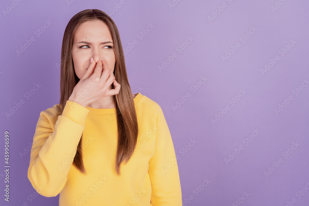 Portrait of displeased tired mad lady hold cover nose look empty space disgusted smell on violet background Portrait of displeased tired mad lady hold cover nose look empty space disgusted smell on violet background