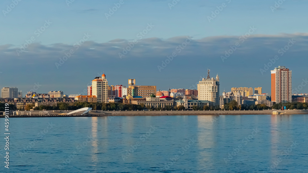 View of the embankment of the city of Heihe, China from the city of Blagoveshchensk, Russia. Border river Amur in the autumn morning.