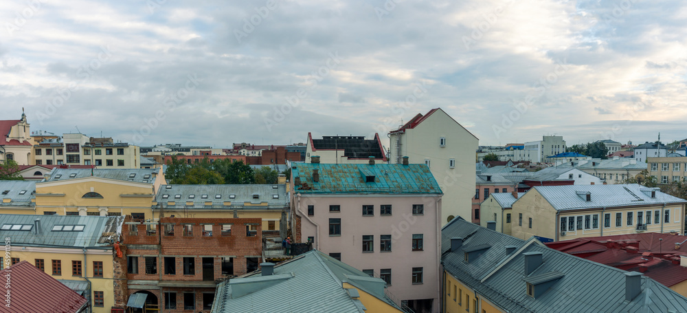 Fototapeta premium Tile roofs over historical city center. Top view of the historic part of Minsk, Belarus.