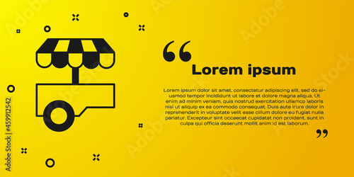 Black Fast street food cart with awning icon isolated on yellow background. Urban kiosk. Vector