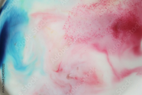 pink and blue ink swirl background beautiful marble effect with gradient pastel shades of vivid pink and blue 