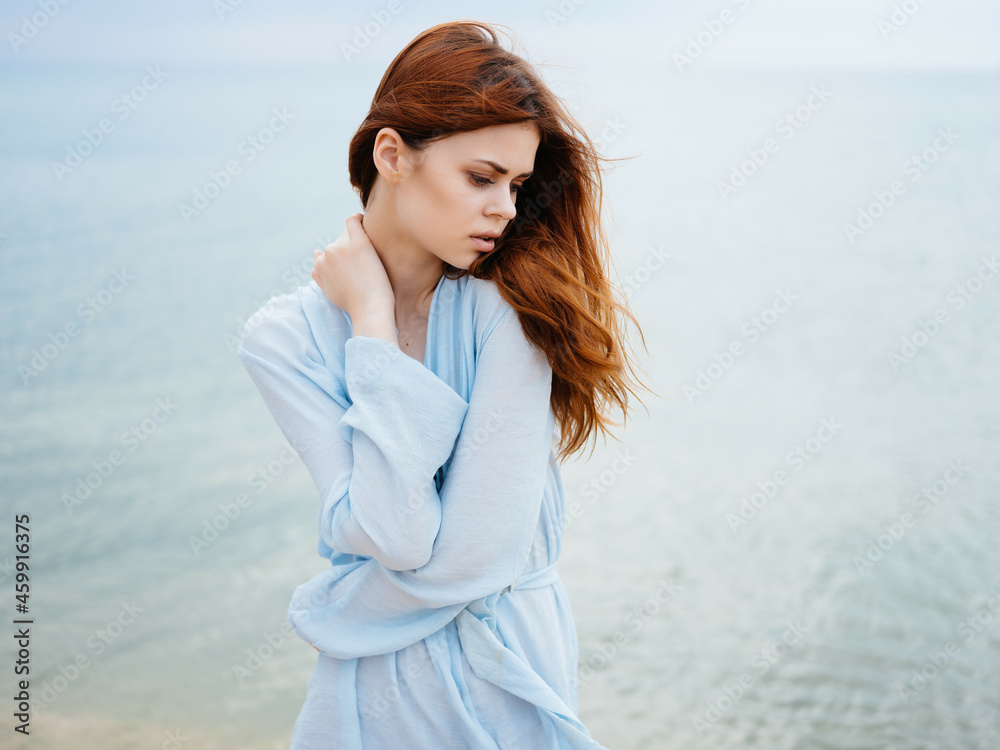 woman in dress red hair beach ocean fresh air leisure woman in dress red hair beach ocean fresh air leisure