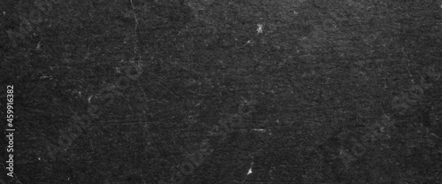 Black old paper texture ma used as background.  Paper texture looking like conrete.