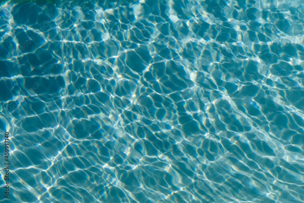 Clear blue ripples on water in a swimming pool or sea