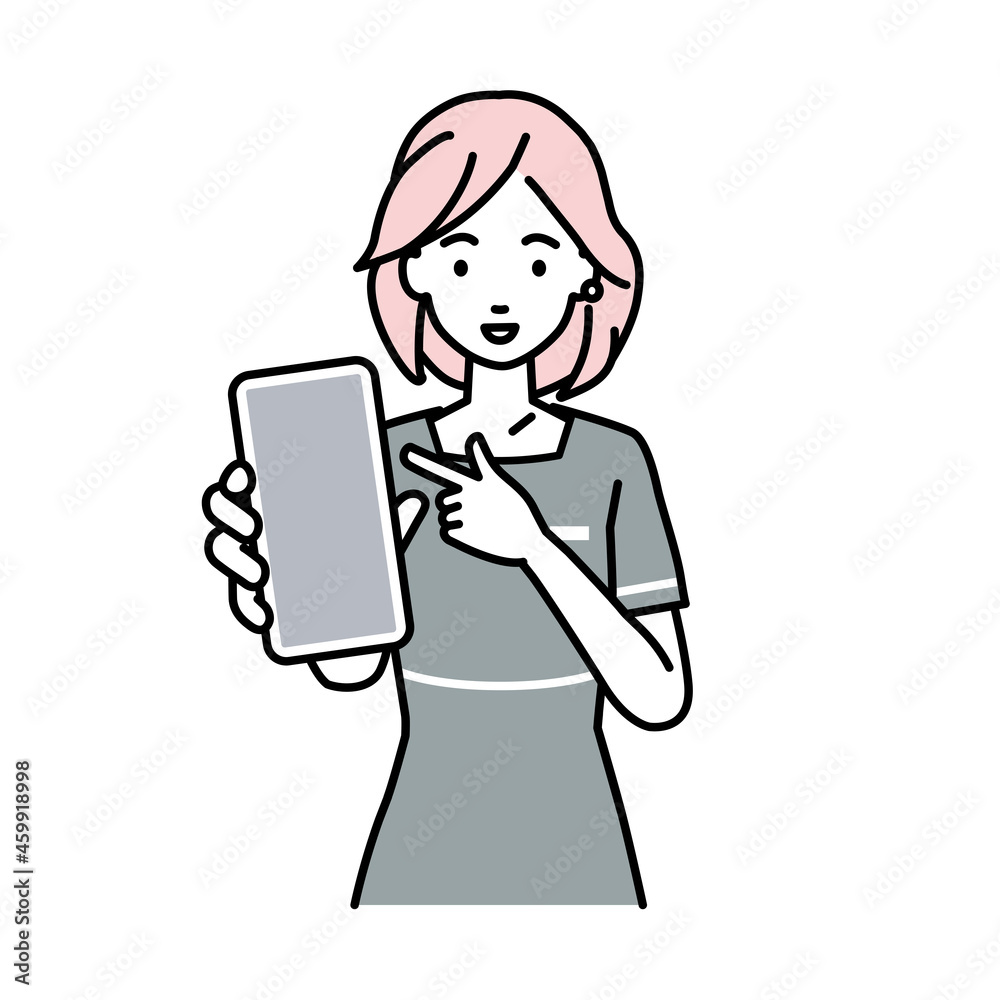 立ってスマートフォンを指差してこちらに向けて見せているエステ店員の女性