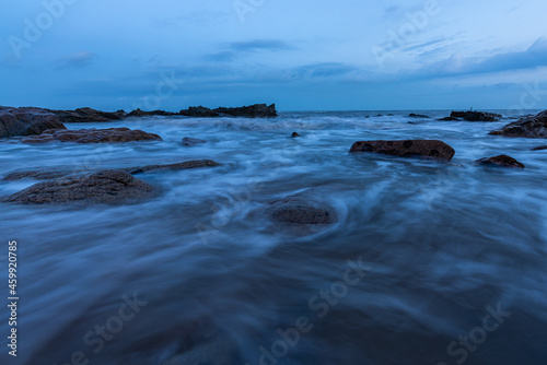 In the evening  the sea slapped the rocks