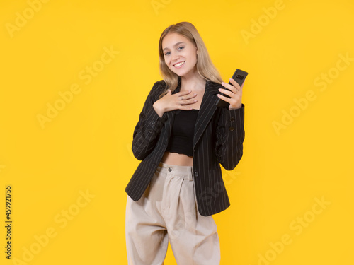Girl on yellow background. ...