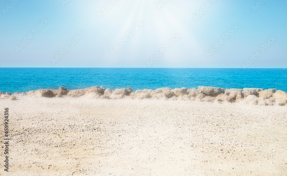 Beach summer background, Seascape, blue sky, turquoise sea and white sand, sun shines tenderly, Holiday summer beach background. soft selective focus.