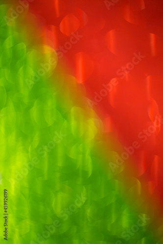 Colorful bokeh background. Festive Christmas shiny background. Brilliant colored light.