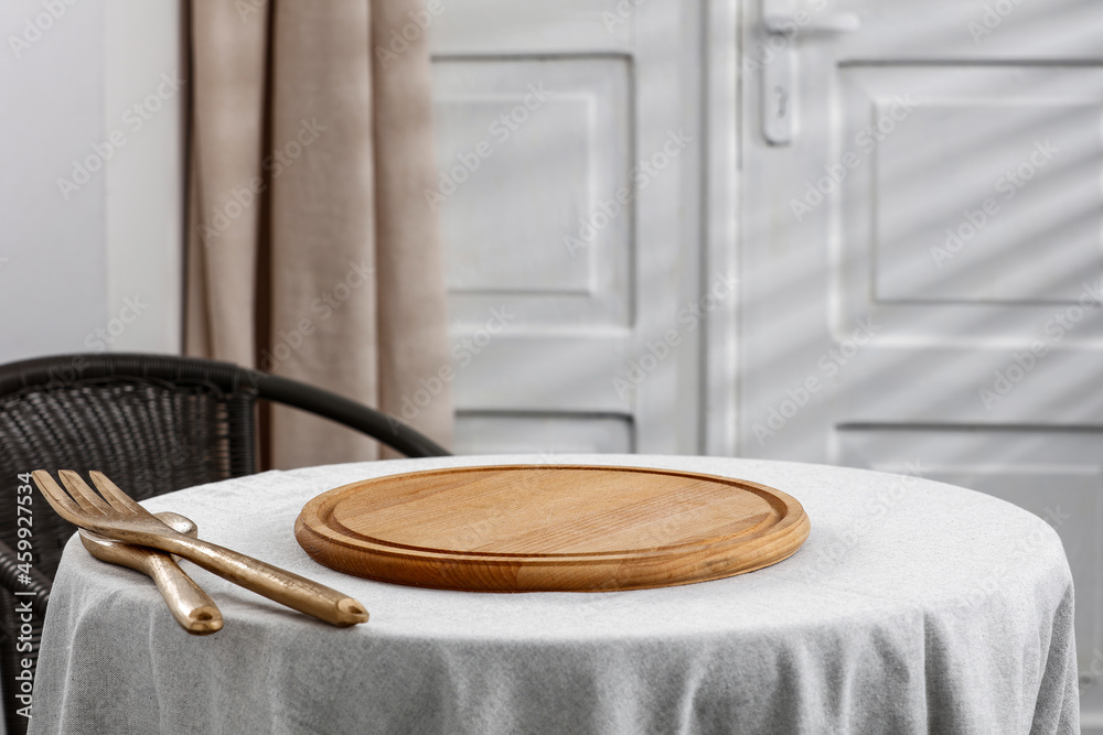Christmas round table on a background of white doors with a shadow and a free space Christmas round table on a background of white doors with a shadow and a free space