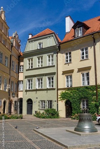 Typical Polish houses, with the narrowest house in Poland in the picture, there is also a bell