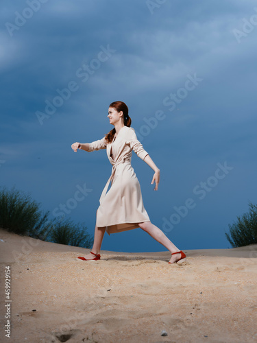 woman walk along the beach sand tropics lifestyle fashion