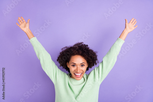 Photo of attractive young dark skin happy woman raise hands good mood enjoy isolated on purple color background