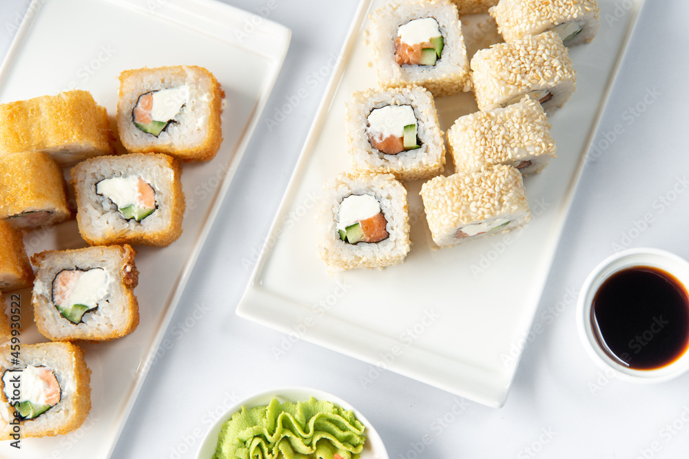 sushi rolls on a white plate on a white background